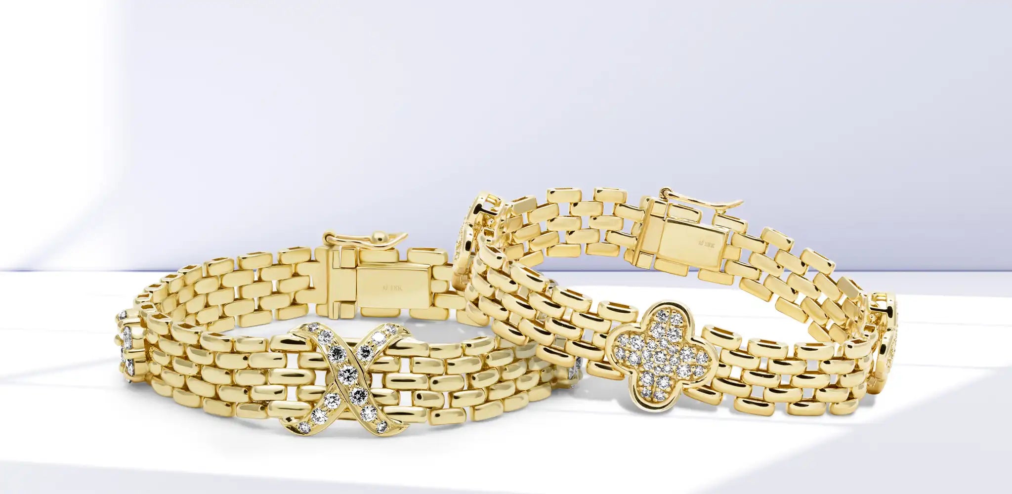 Two gold brick link bracelets with diamond-accented X and floral motifs on a soft neutral background | Singhvi Jewels Brick Link Collection