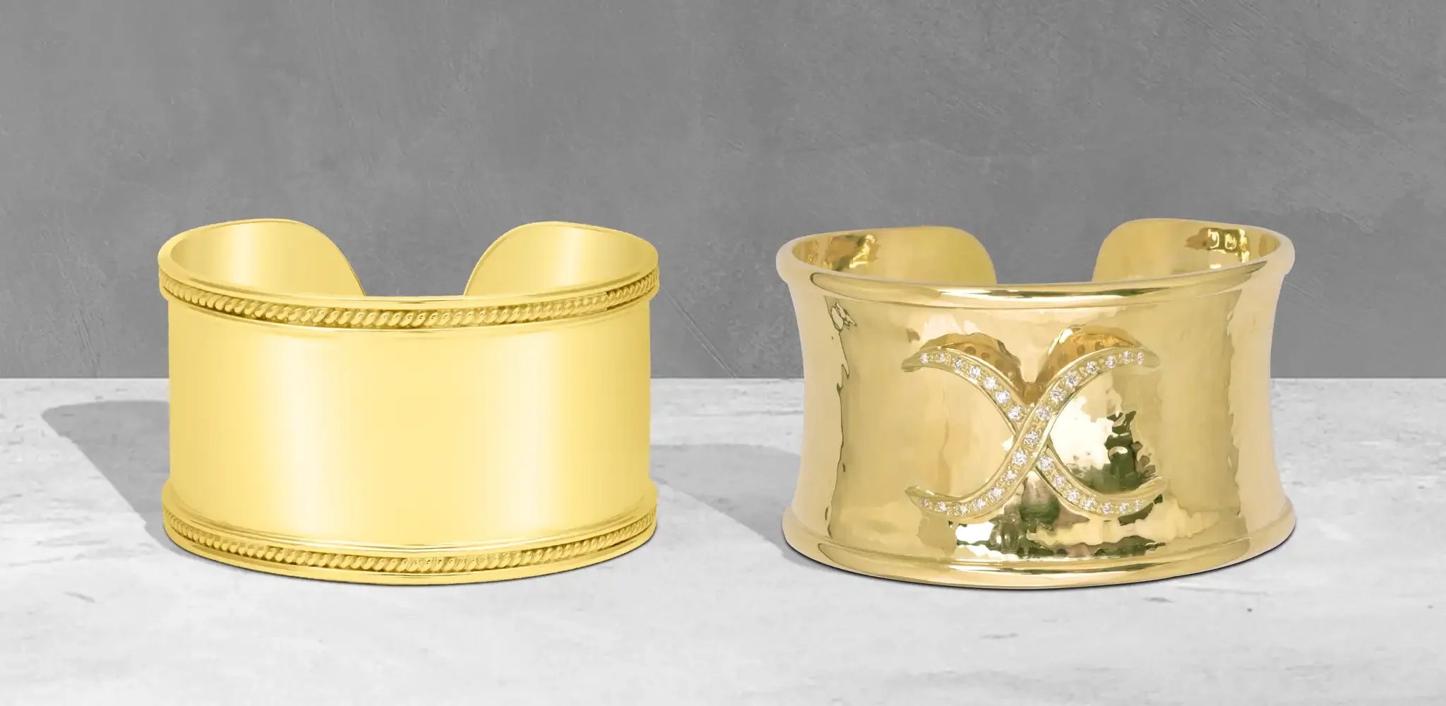 Two gold cuff bangles with polished finishes and subtle diamond details on a soft gray background | Singhvi Jewels Cuff Collection