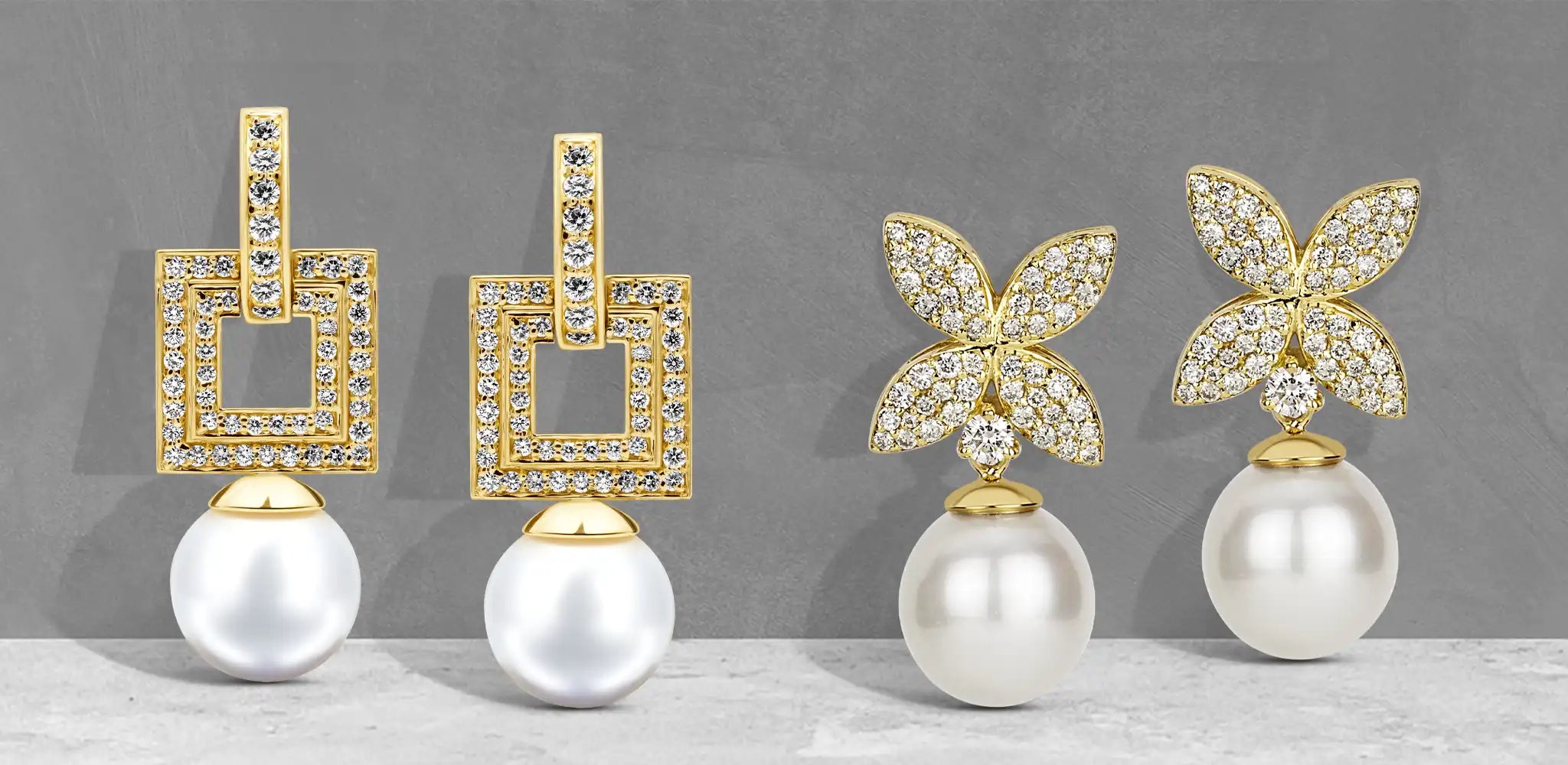Two pairs of gold dangle earrings with diamond details and white pearl drops, featuring square shapes and floral-inspired designs | Singhvi Jewels Dangle Earrings Collection
