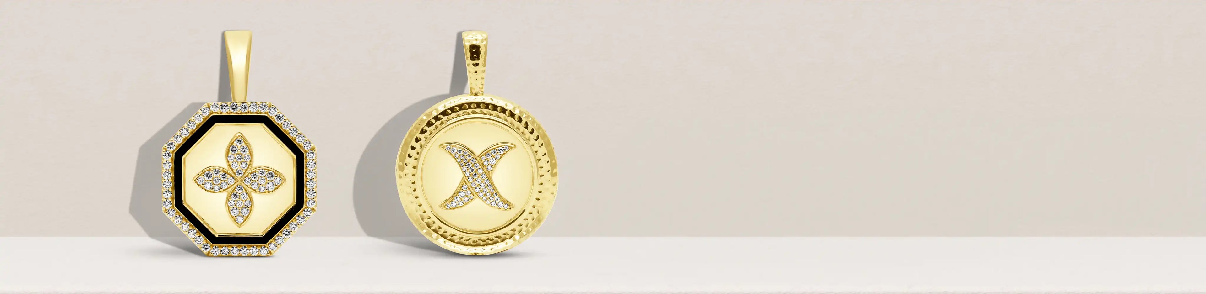 Two gold pendants with diamond-accented floral and X motifs on a soft beige background | Singhvi Jewels Pendants Collection