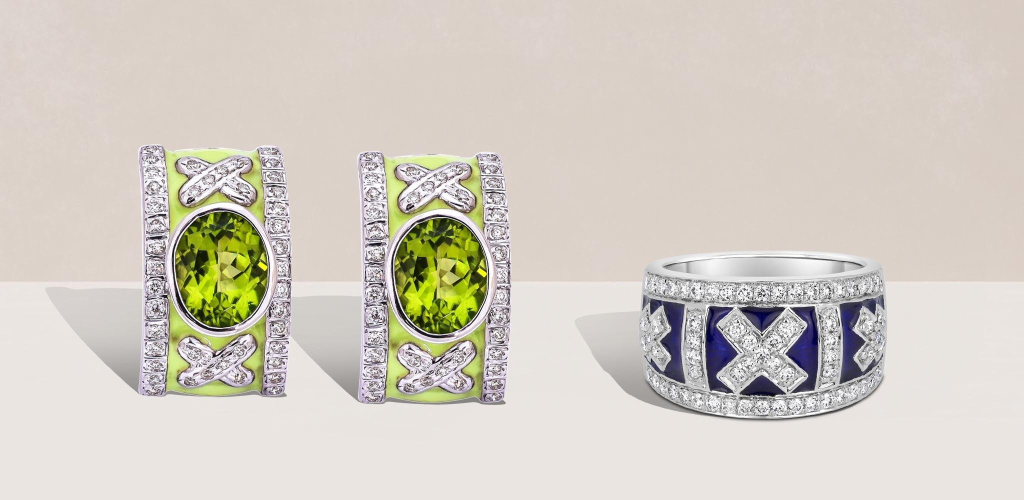 A pair of X-designed silver earrings with green oval gemstones, pale green enamel, and diamond accents beside a silver ring with blue enamel and diamonds on a soft beige background | Singhvi Jewels Sterling Silver Jewelry Collection